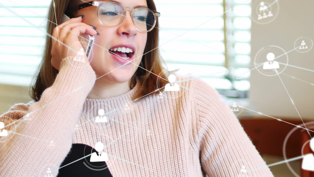 Animation of profile icons connecting with lines over beautiful caucasian woman talking on phone