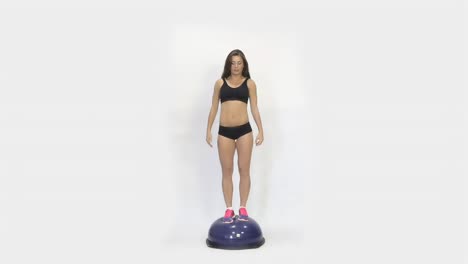 woman balancing on a balance ball