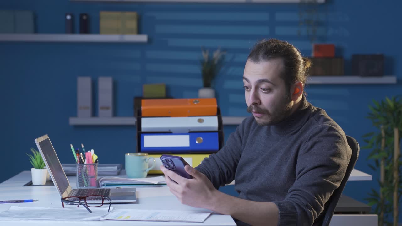 Young man reading joyful news becomes happy and rejoicing.
