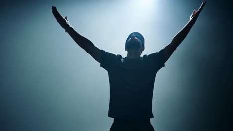 blindfolded man removes his blindfold in a smoky studio, symbolizing hope, freedom, and the journey toward enlightenment