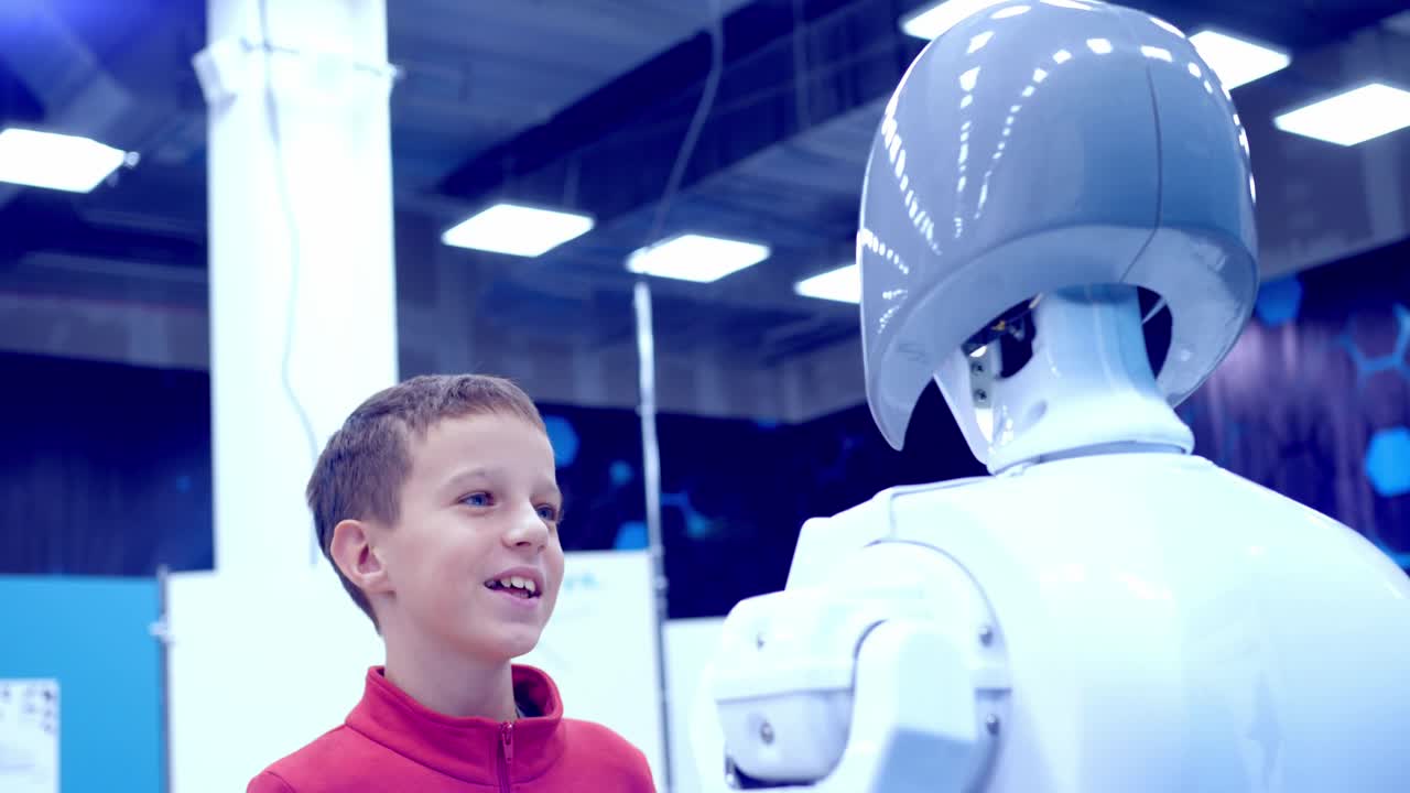 Boy interacting with a robot