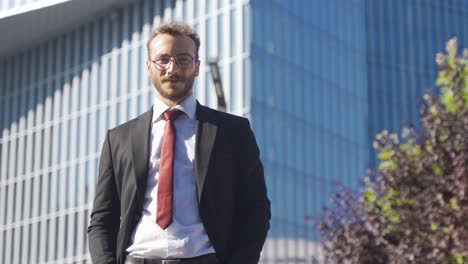 business man looking at camera and smiling.