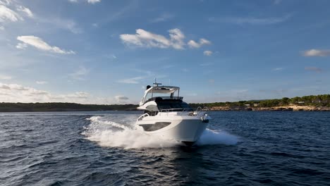 luxury yacht driving at mediterranean sea close up drone shot
