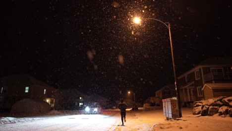 running in city at night in powder snow