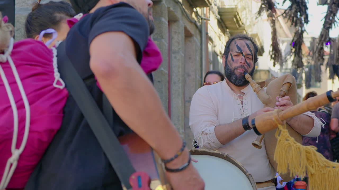 Bagpiper Playing Traditional Music at a Street Festival