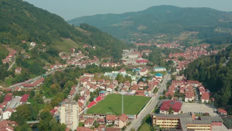 aerial truck shot over the valley town of ivanjica in serbia on a bright day