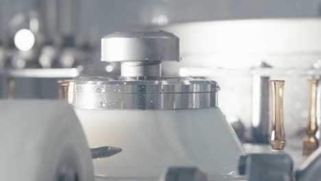 chemical liquids rotating on a conveyor machine in a modern pharmaceutical manufacturing factory