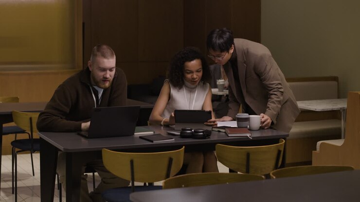 Group of colleagues working together in a modern office space