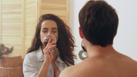 Young-married-couple-drinking-wine-at-home