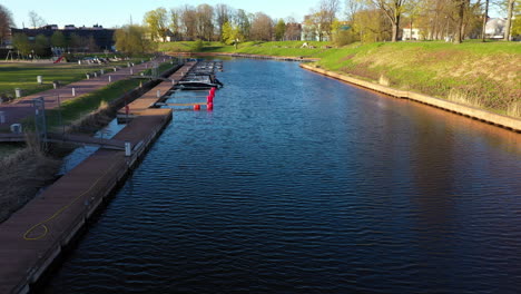 Aerial-View-of-Marina-and-Promenade-with-Boats-Docked-in-Pärnu-Central-Park,-Estonia