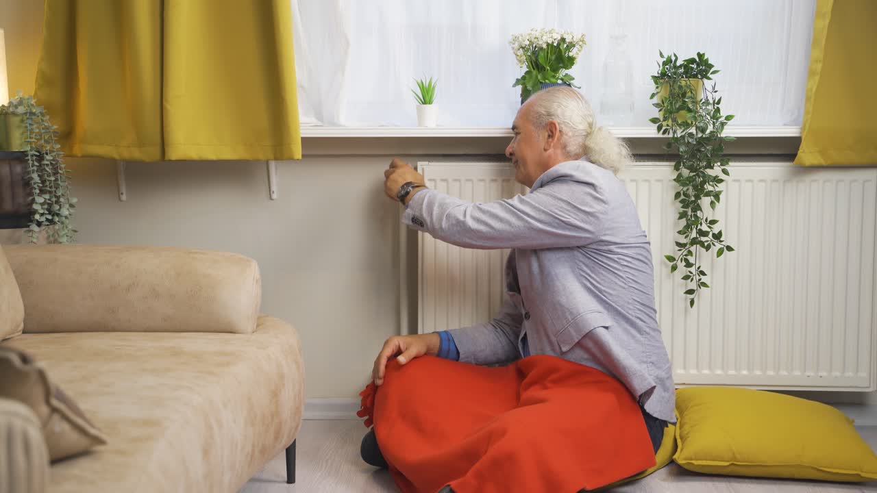 ⁇ 은이는 난방기의 온도를 낮추고 차갑습니다.