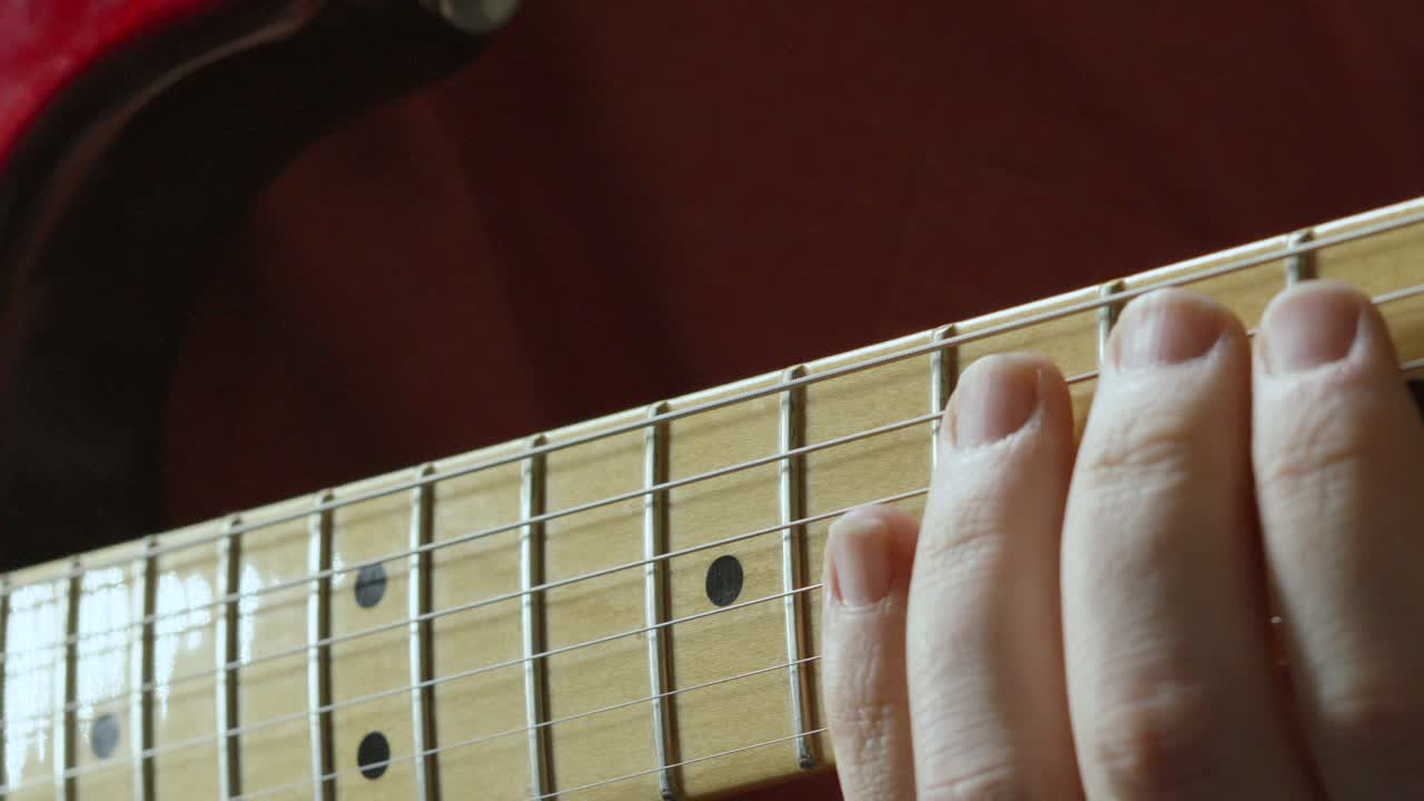 Guitarist Hand Moving Up and Down Fretboard of Stratocaster Guitar Playing Various Chords 4K