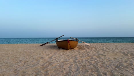 Minimal-ocean-landscape-nature-wide-view-of-old-wooden-red-boat-in-the-sand-beach-seaside-coastal-village-life-rural-people-countryside-in-tropical-climate-hot-summer-season-in-Iran-Qatar-Oil-industry