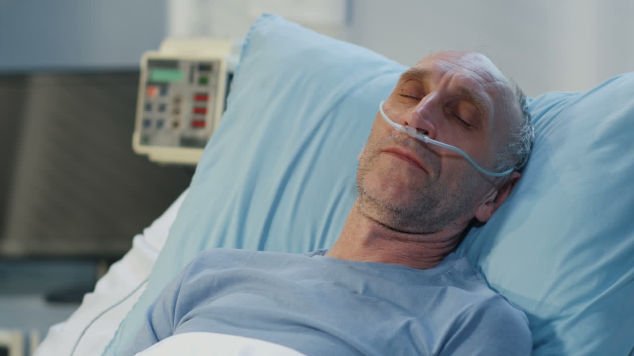 Elderly Man in Hospital Bed