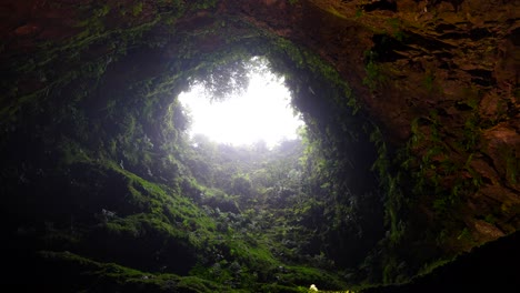 raindrops fall through algar do carvao hole in terceira, azores