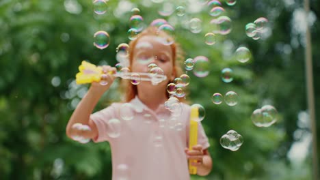 girl blowing bubbles outdoors