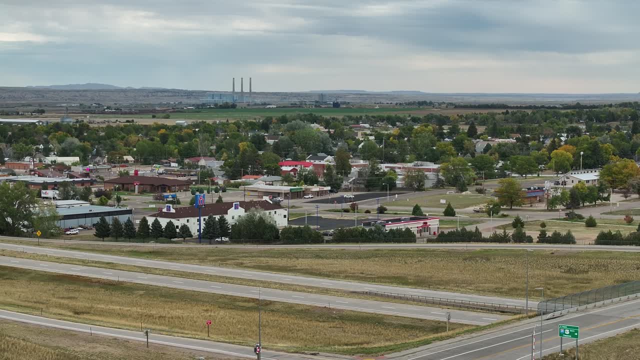 Wheatland Wyoming off ramp view into town with powerplant in the distance. Drone 4k aerial view
