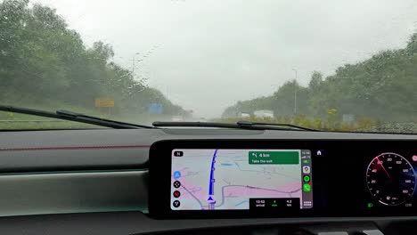 car driving in rain with gps navigation