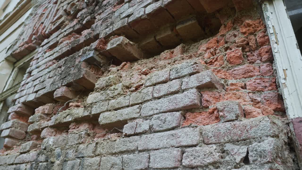 Crumbling brick walls decay of neglected spa sanatorium building ruin