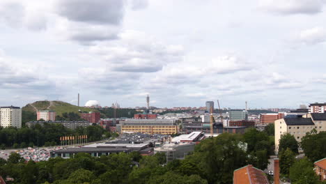 Apartment-and-industrial-buildings-of-Nacka-district-in-Stockholm-city,-aerial-tilt-down-shot