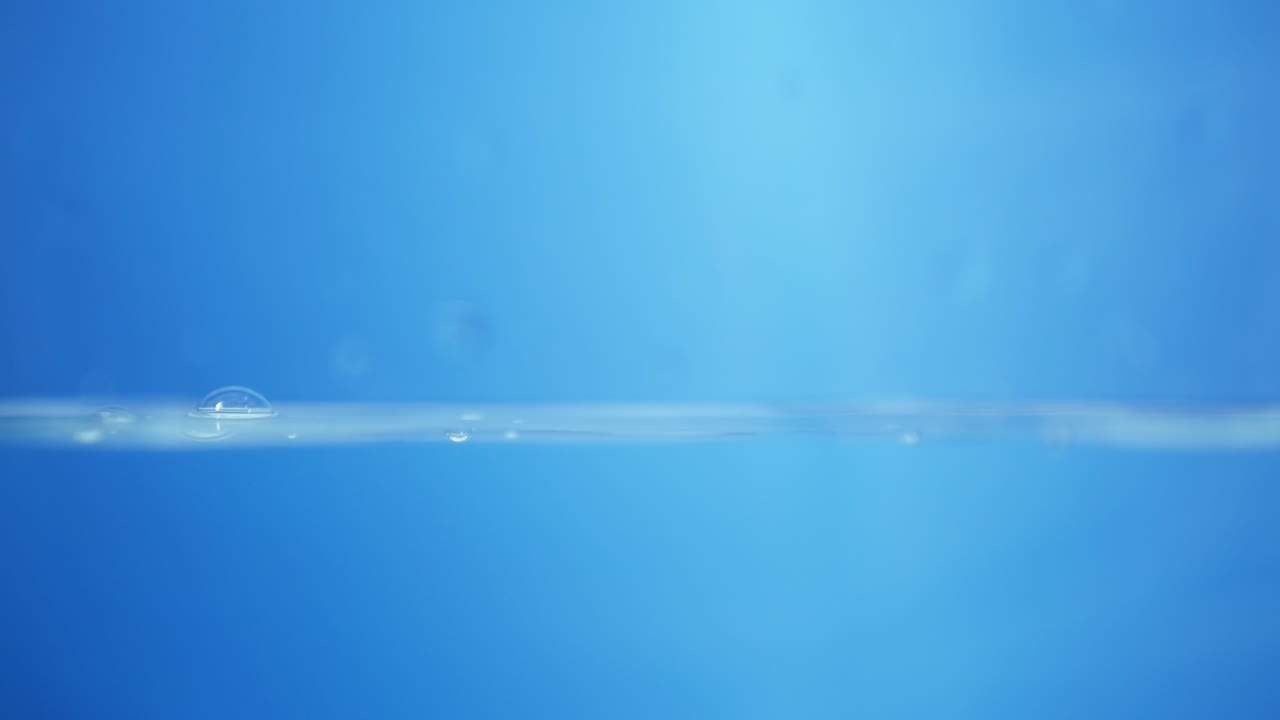 Water Surface with Drops and Bubbles