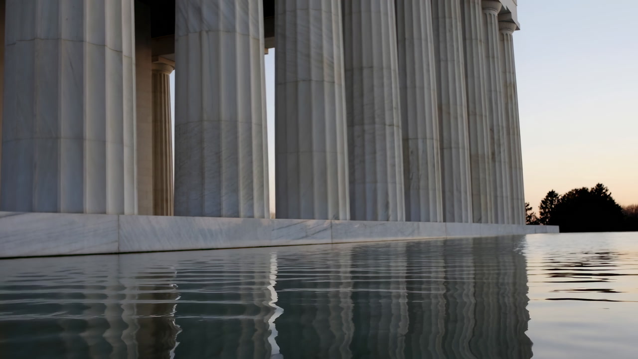 Dusk Columns Reflected In Pool, Neoclassical Memorial With Marble Pillars Rising Over Glassy Water, Soft