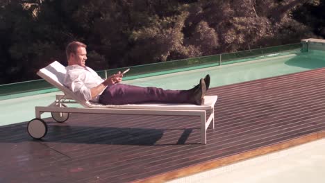 Man-using-tablet-in-the-garden