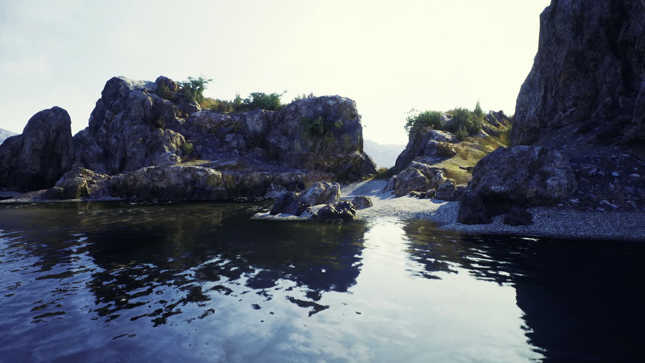 Beautiful rocky shoreline with calm waters and lush greenery near the coast