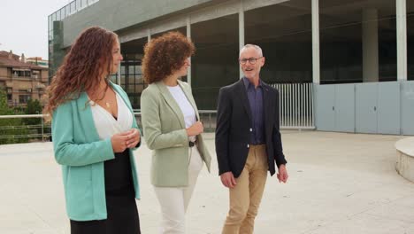three business people walking outside