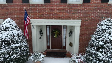 close up shot of a brick house with american flag