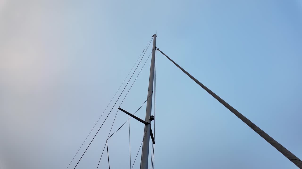 The mast of a yacht without flags and sails, only ropes. Euroe Denmark.