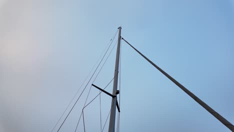the mast of a yacht without flags and sails, only ropes. euroe denmark.