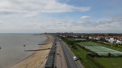 aerial beach shot from above. uk drone over sea and sandy beach. 4k stock video aerial view of uk sandy beach seascape.