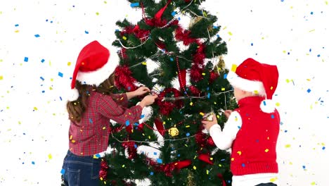 Animation-of-confetti-falling-over-caucasian-children-decorating-christmas-tree-on-white-background