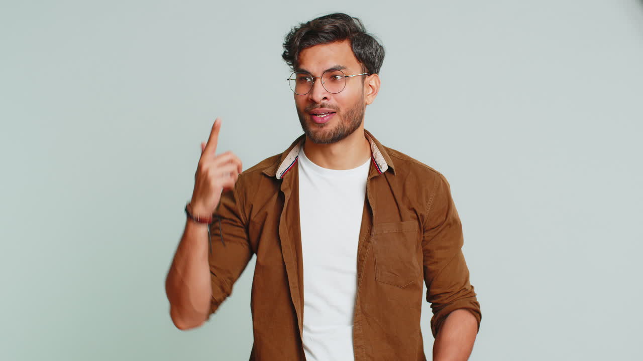 Inspired Indian man having good idea, plan, startup, showing inspiration motivation Eureka gesture