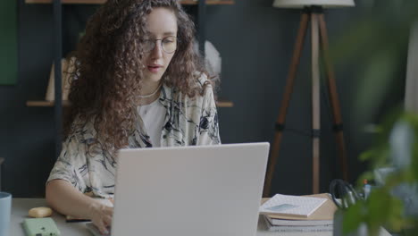 Young Woman Working on Laptop and Making Online Payment