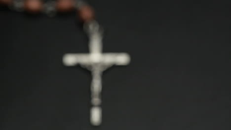 rosary beads on a bible