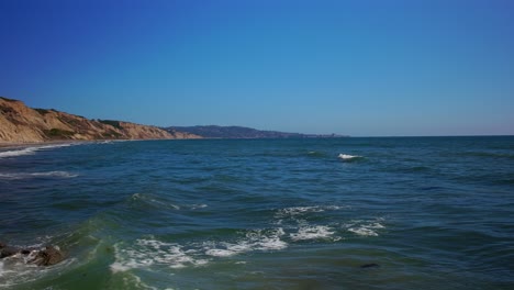 panning right view of a beach in san diego with a great view of the cliffs, rocks, and pacific ocean