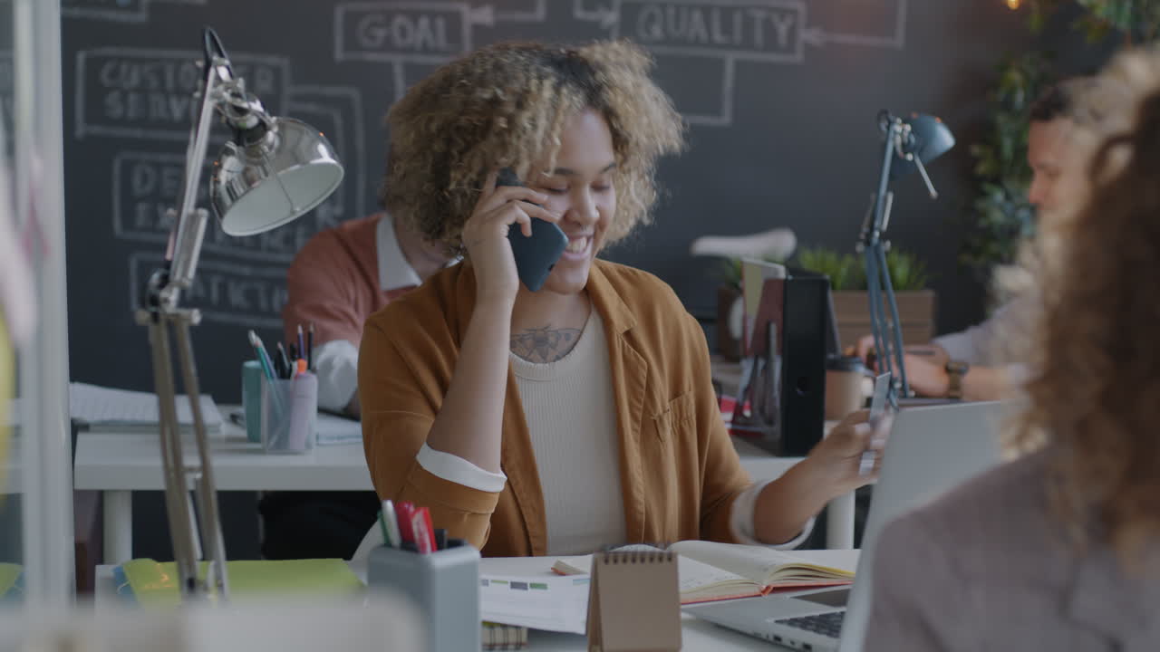 Businesswoman on Phone Call in Modern Office