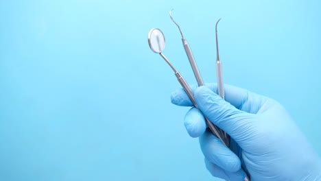 dentist holding dental instruments