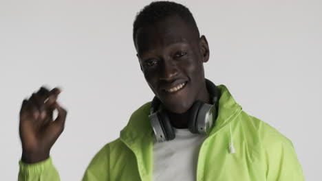 Happy-African-american-man-on-grey-background.