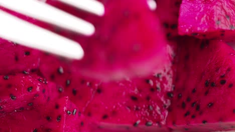 close up of dragon fruit slices on a fork