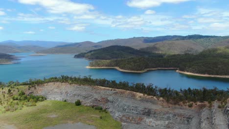 rock wall in foreground,panoramic view of advancetown lake on a calm summers day, pan