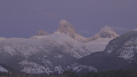 panning shot to high mountain peaks at sunset in western wyoming