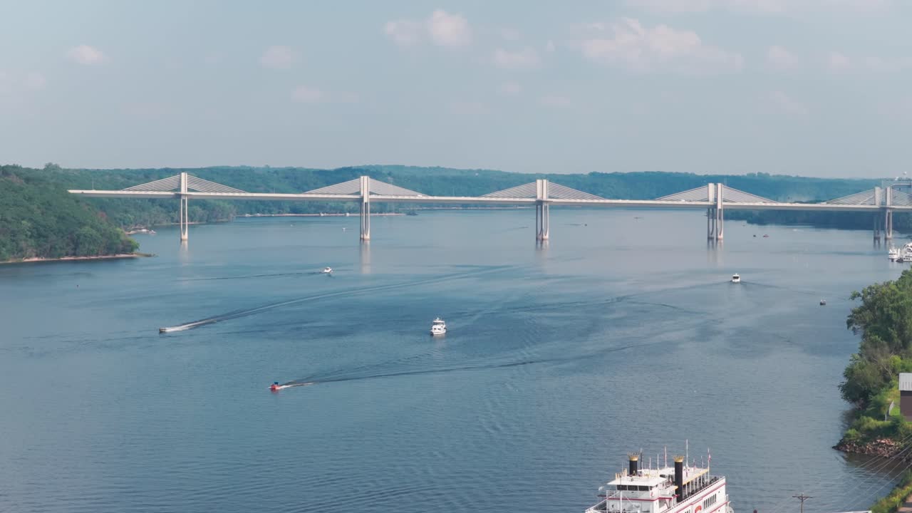 Aerial telephoto rising shot of the St. Croix Crossing bridge from the historic Commander Building in Stillwater, Minnesota. 4K