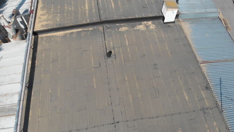 top down shot of grey roof with sawdust lying in corners