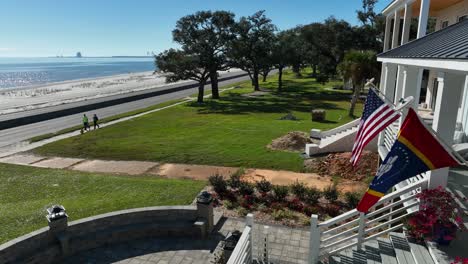 usa and mississippi flags at vacation home on gulf coast