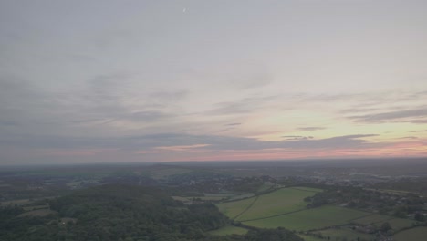 aerial drone panning shot of sunset in countryside