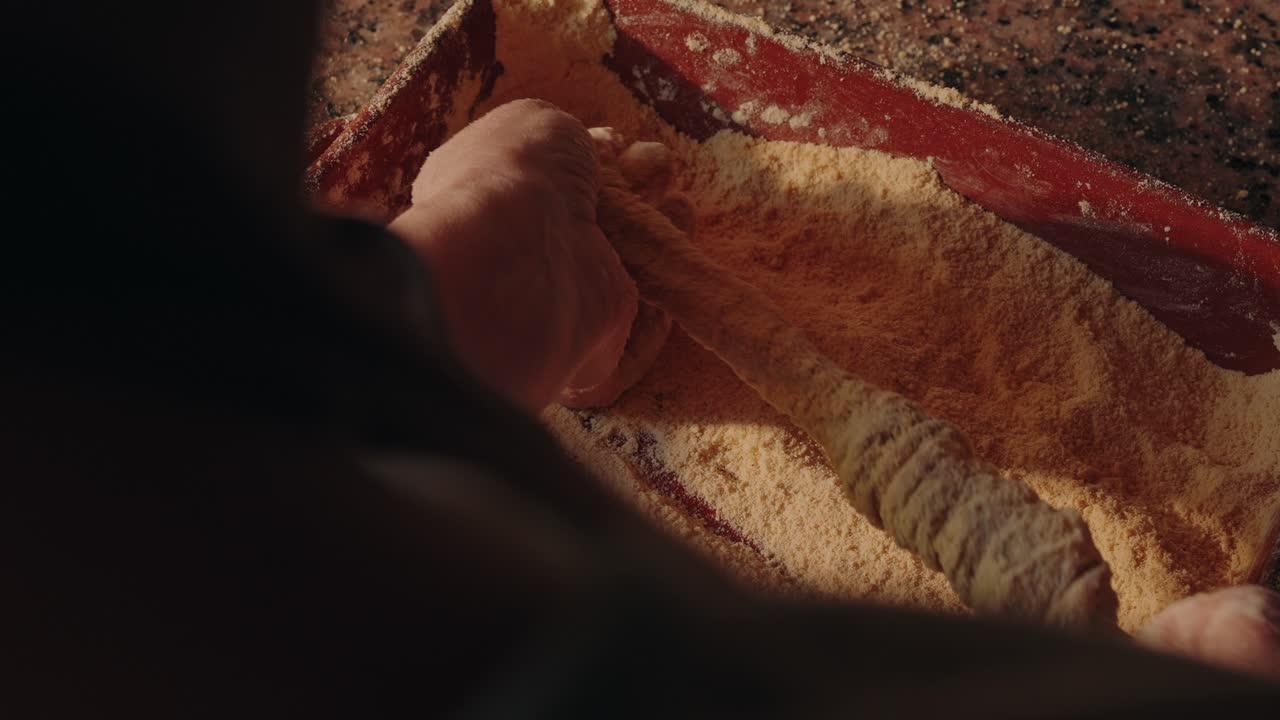 Cleaning pork intestines in flour during traditional prep in Minho region Portugal