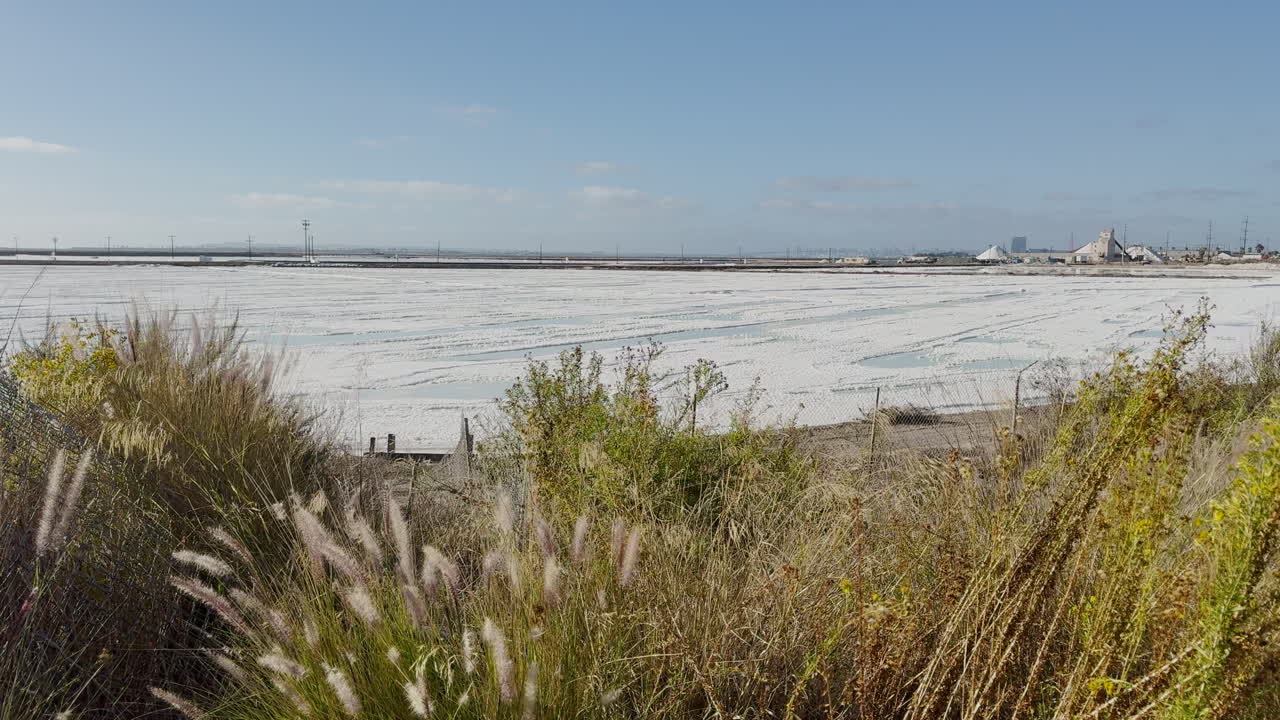 South Bay salt production farm in Imperial Beach, California, USA. Panning shot of white salt flats